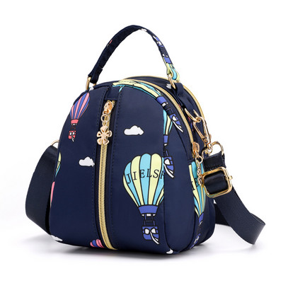 Naiste tekstiilist seljakott värvilise aplikatsiooniga