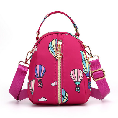 Naiste tekstiilist seljakott värvilise aplikatsiooniga