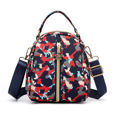 Naiste tekstiilist seljakott värvilise aplikatsiooniga