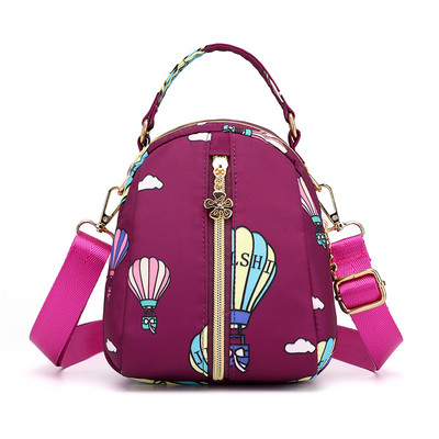 Naiste tekstiilist seljakott värvilise aplikatsiooniga