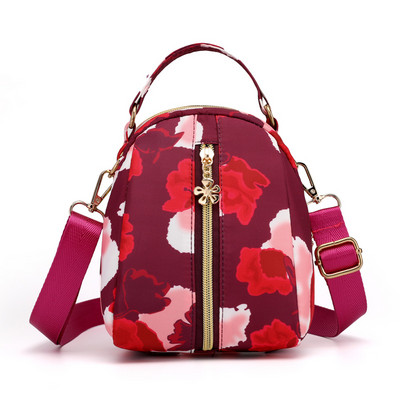 Naiste tekstiilist seljakott värvilise aplikatsiooniga