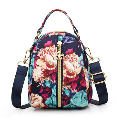 Naiste tekstiilist seljakott värvilise aplikatsiooniga