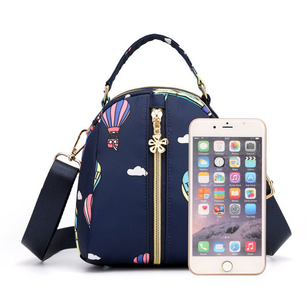 Naiste tekstiilist seljakott värvilise aplikatsiooniga