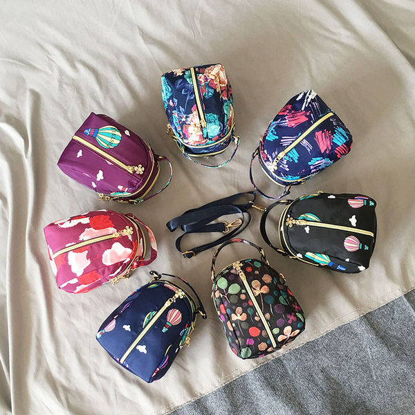 Naiste tekstiilist seljakott värvilise aplikatsiooniga