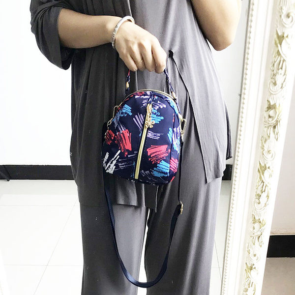 Naiste tekstiilist seljakott värvilise aplikatsiooniga