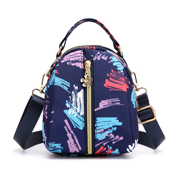 Naiste tekstiilist seljakott värvilise aplikatsiooniga