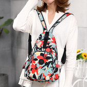 Naiste suur lillemotiivide ja tõmblukuga seljakott