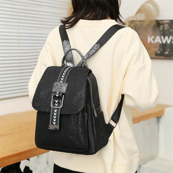 Naiste seljakott musta värvi ja tekstiilist rihmadega