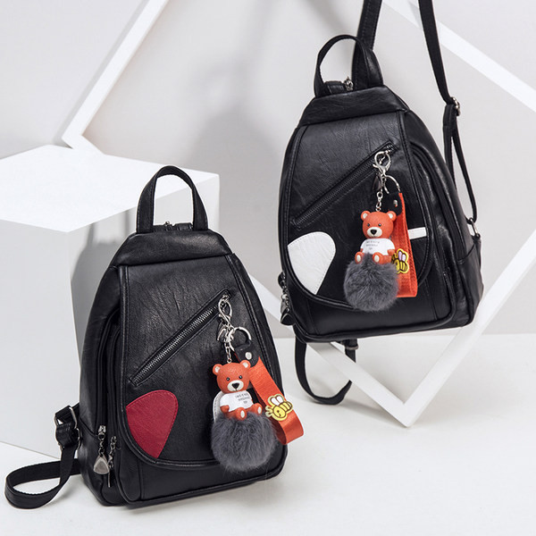 Naiste kunstnahast seljakott ja ripats udusulgedega