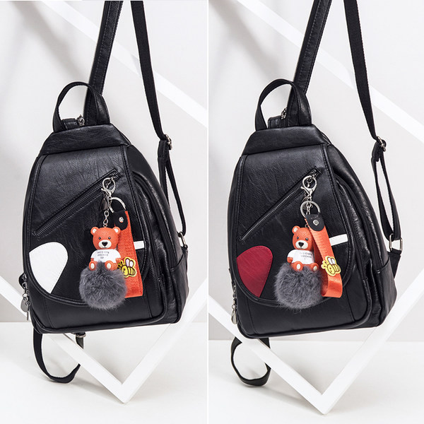 Naiste kunstnahast seljakott ja ripats udusulgedega