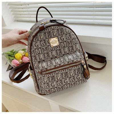 Eko-nahast ja tekstiilist ning ökonahast vabaaja seljakott naistele metallkinnitusega