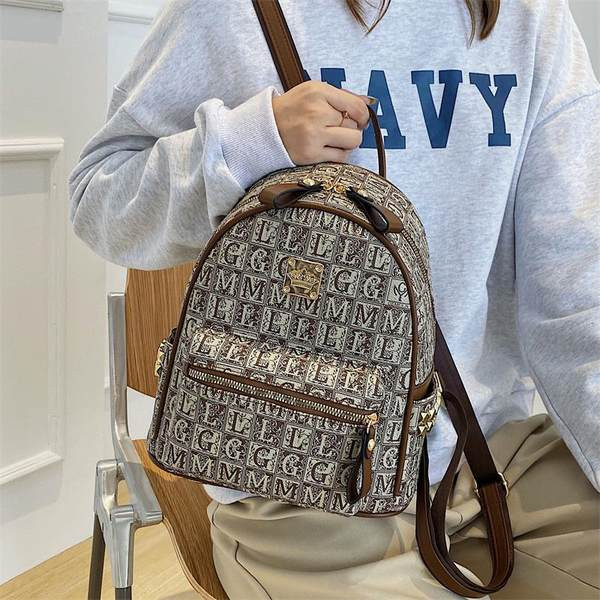 Eko-nahast ja tekstiilist ning ökonahast vabaaja seljakott naistele metallkinnitusega