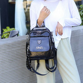 Naiste lakknahast seljakott metallelemendiga