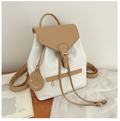 Naiste ajakohane lipsude ja lukuga seljakott