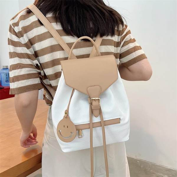 Naiste ajakohane lipsude ja lukuga seljakott