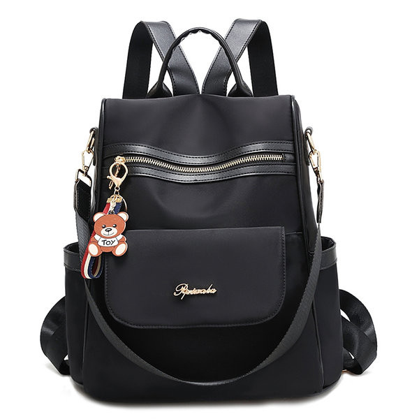 Naiste stiilne seljakott, millel on ees tõmblukk ja kiri