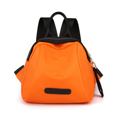 Naiste tekstiilist seljakott ja lühike käepide