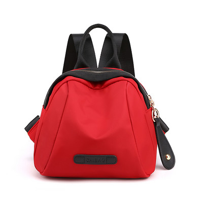 Naiste tekstiilist seljakott ja lühike käepide