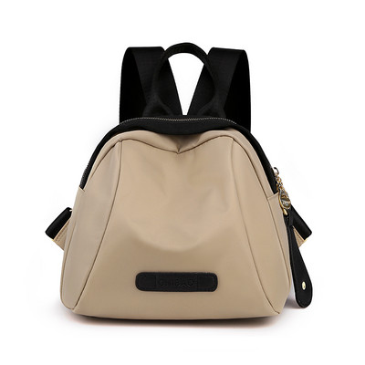 Naiste tekstiilist seljakott ja lühike käepide