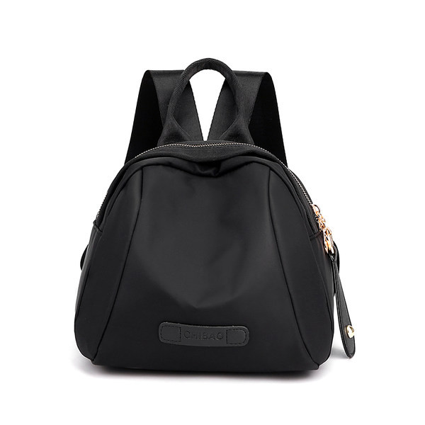 Naiste tekstiilist seljakott ja lühike käepide