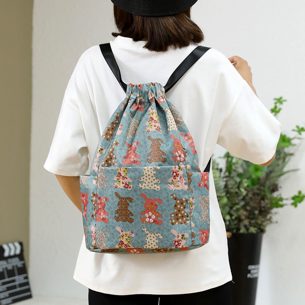 Värviline lõuendist taskutega seljakott