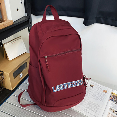 Tekstiilist seljakott neljas värvitoonis kirjadega