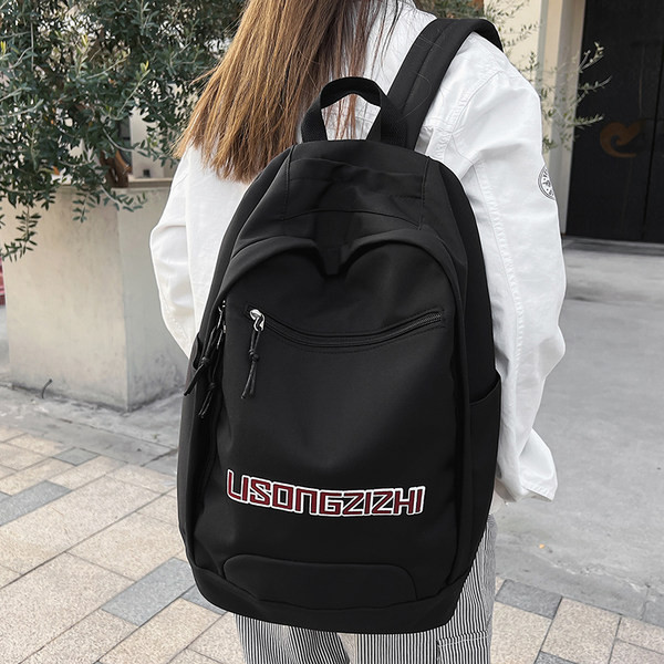 Tekstiilist seljakott neljas värvitoonis kirjadega