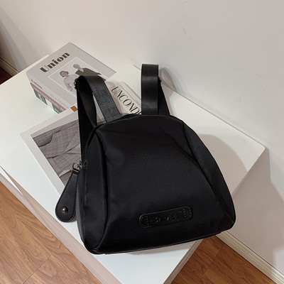 Naiste seljakott oranži ja musta värviga