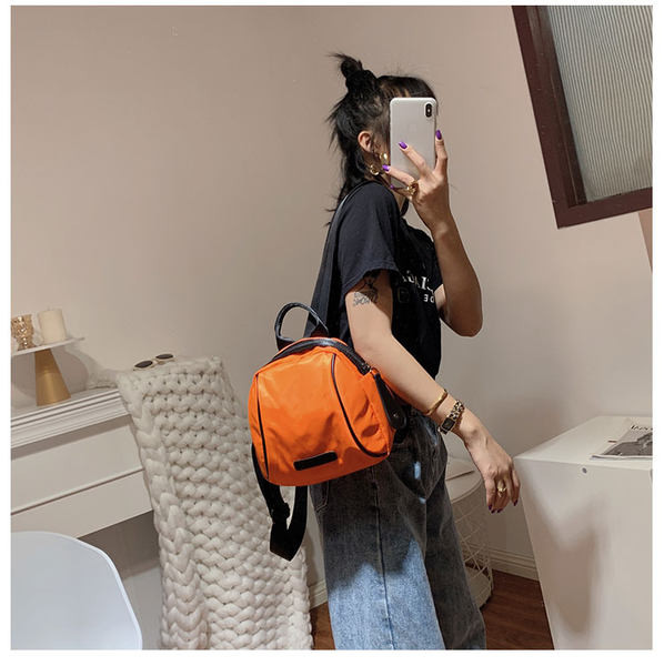 Naiste seljakott oranži ja musta värviga