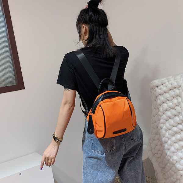 Naiste seljakott oranži ja musta värviga