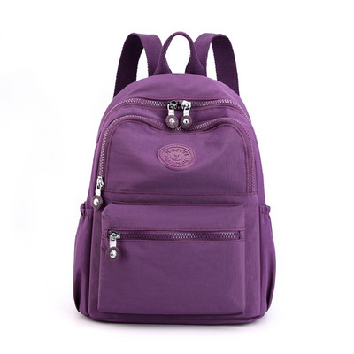 Väike lukuga tekstiilist seljakott - naistele