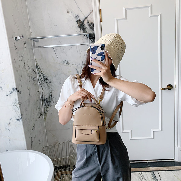 Női bőr hátizsák különböző színekben cipzárral