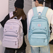 Naiste tekstiilist seljakott tasku ja embleemiga