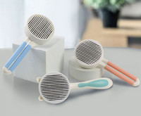 Ümmargune hari koerte kammimiseks - kaks suurust