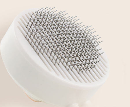 Ümmargune hari koerte kammimiseks - kaks suurust