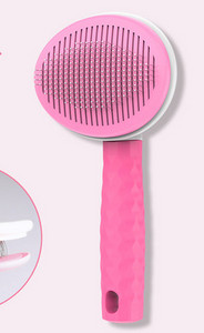 Ümmargune pintsel koera kammimiseks