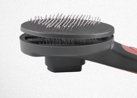 Βούρτσα σκύλου σε στρογγυλό σχήμα και πλαστική λαβή