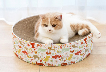 Ξύστρα γάτας από κυματοειδές χαρτί σε στρογγυλό σχήμα