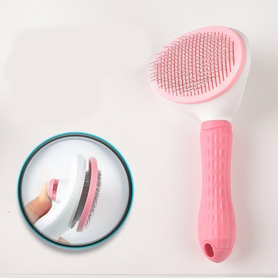 Kasside kammimise pintsel, millel on nööp karvade eemaldamiseks