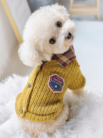 Kootud vest embleemiga koertele