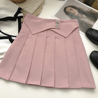 Plisseeritud lühike nööpidega seelik ja kõrge vöökoht