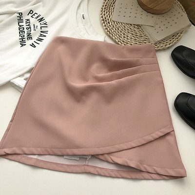 Lühike asümmeetriline kõrge vöökoha ja lukuga seelik