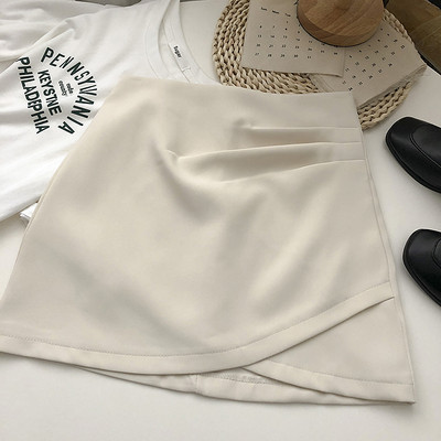 Lühike asümmeetriline kõrge vöökoha ja lukuga seelik