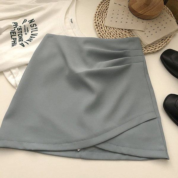 Lühike asümmeetriline kõrge vöökoha ja lukuga seelik