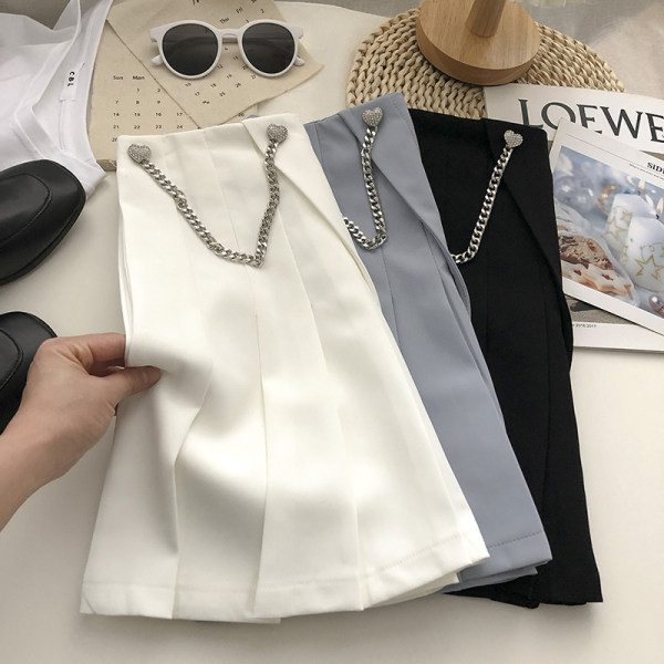 Naiste plisseeritud seelik kõrge vöökoha ja metallist kaunistusega