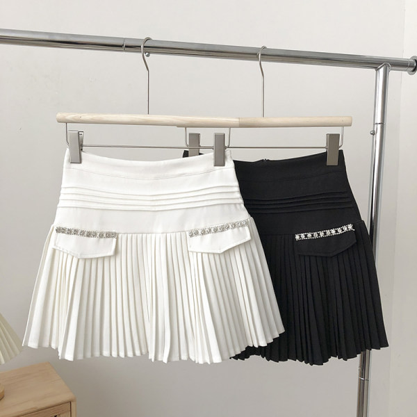 Sieviešu kroku svārki ar akmeņiem viduklī