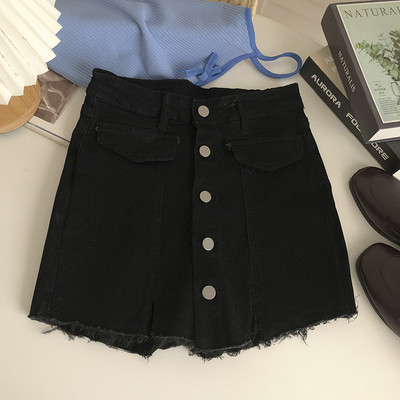 Naiste nööpide ja rebenenud motiividega teksaseelik