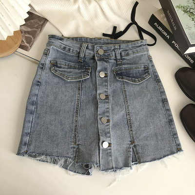 Naiste nööpide ja rebenenud motiividega teksaseelik