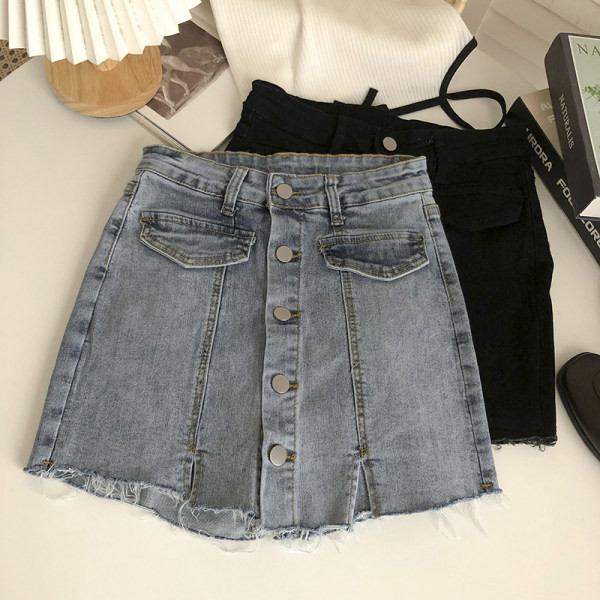 Naiste nööpide ja rebenenud motiividega teksaseelik