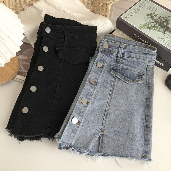 Naiste nööpide ja rebenenud motiividega teksaseelik